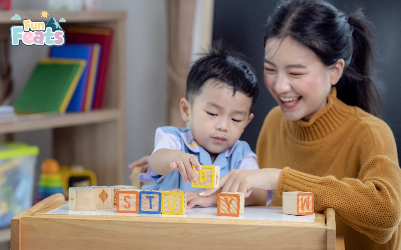 teacher playing wooden blocks with her student