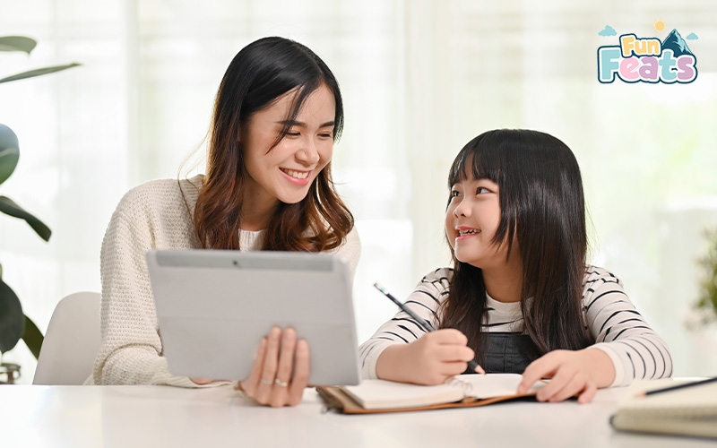 teacher with a tablet teaching a student 1-to-1